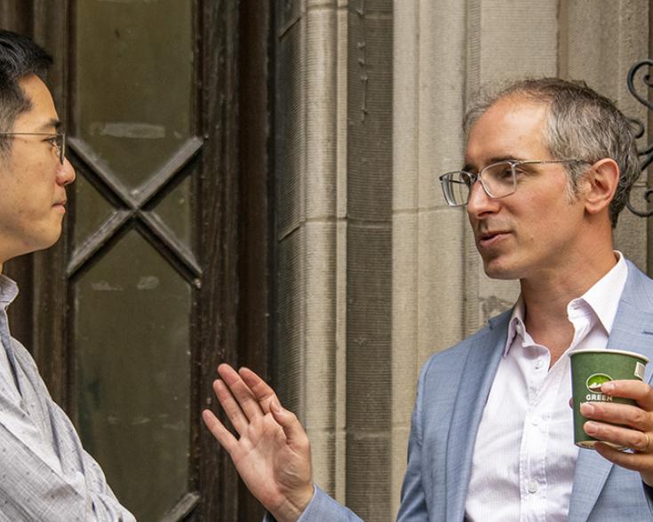 Two men speaking to each other