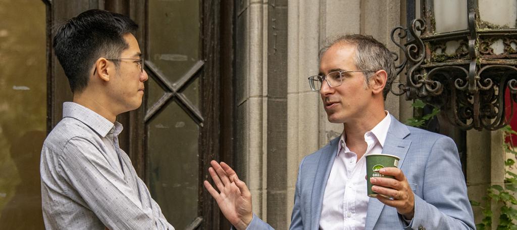 Two men speaking to each other
